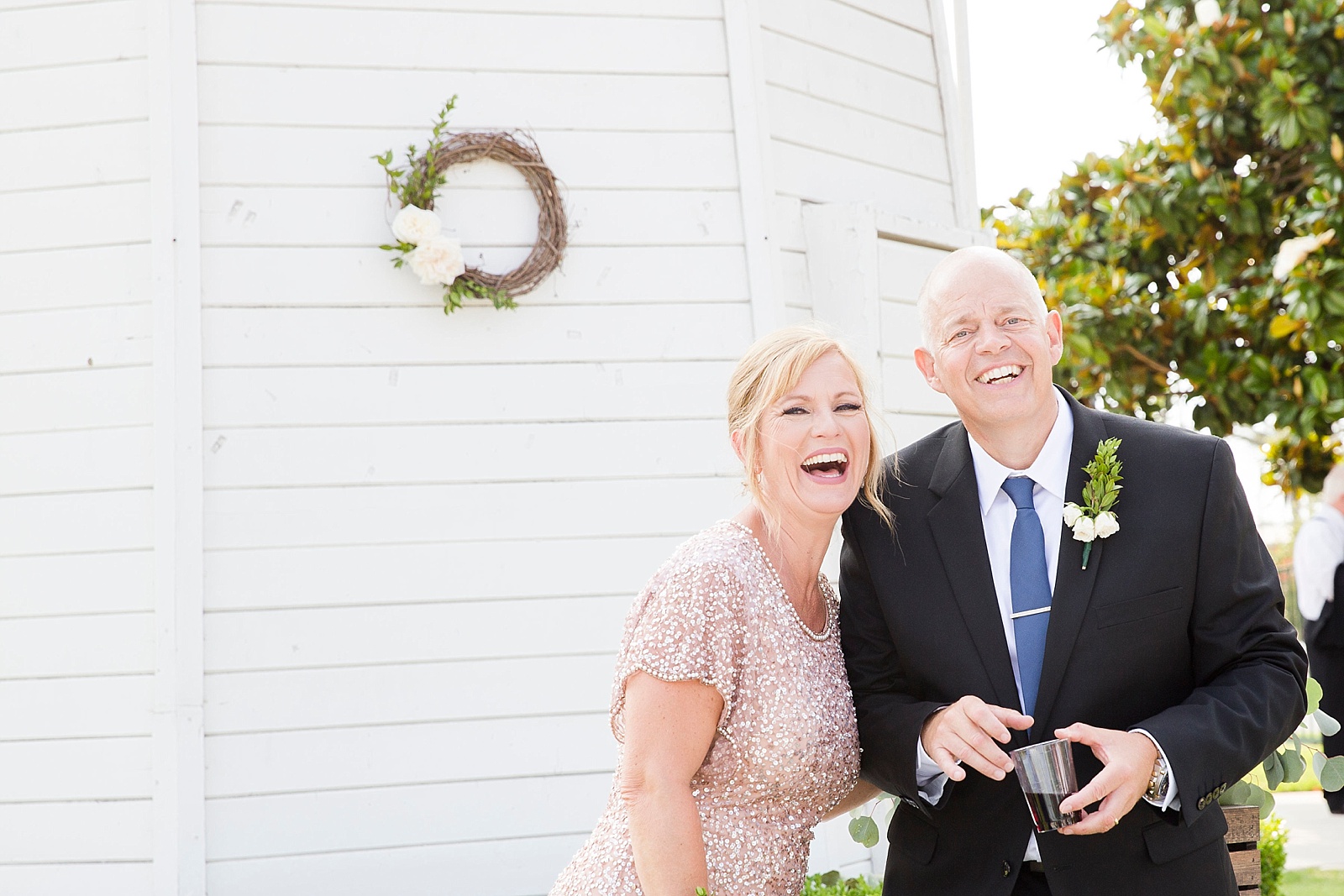parents enjoying Huntington Beach wedding day photographed by Randi Michelle Photography