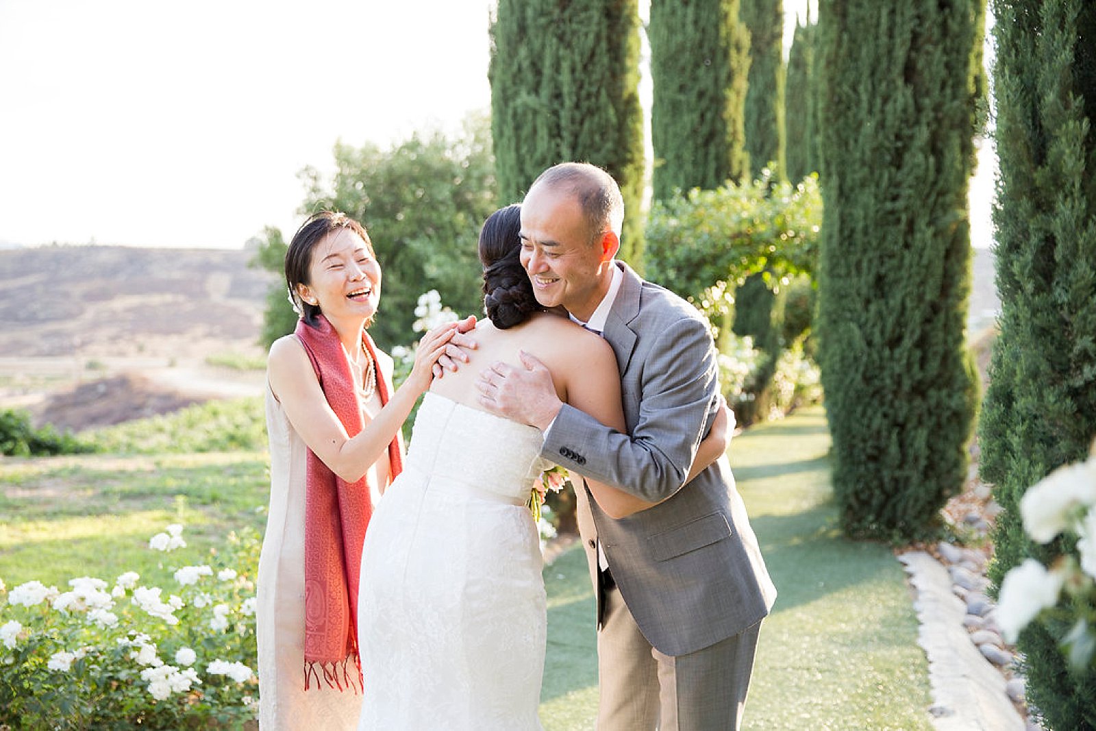 parents of bride embrace bride before Falkner Winery wedding day photographed by Randi Michelle Photography