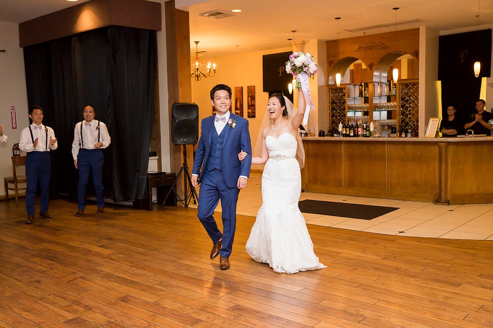 bride and groom enter reception at Falkner Winery photographed by Randi Michelle Photography