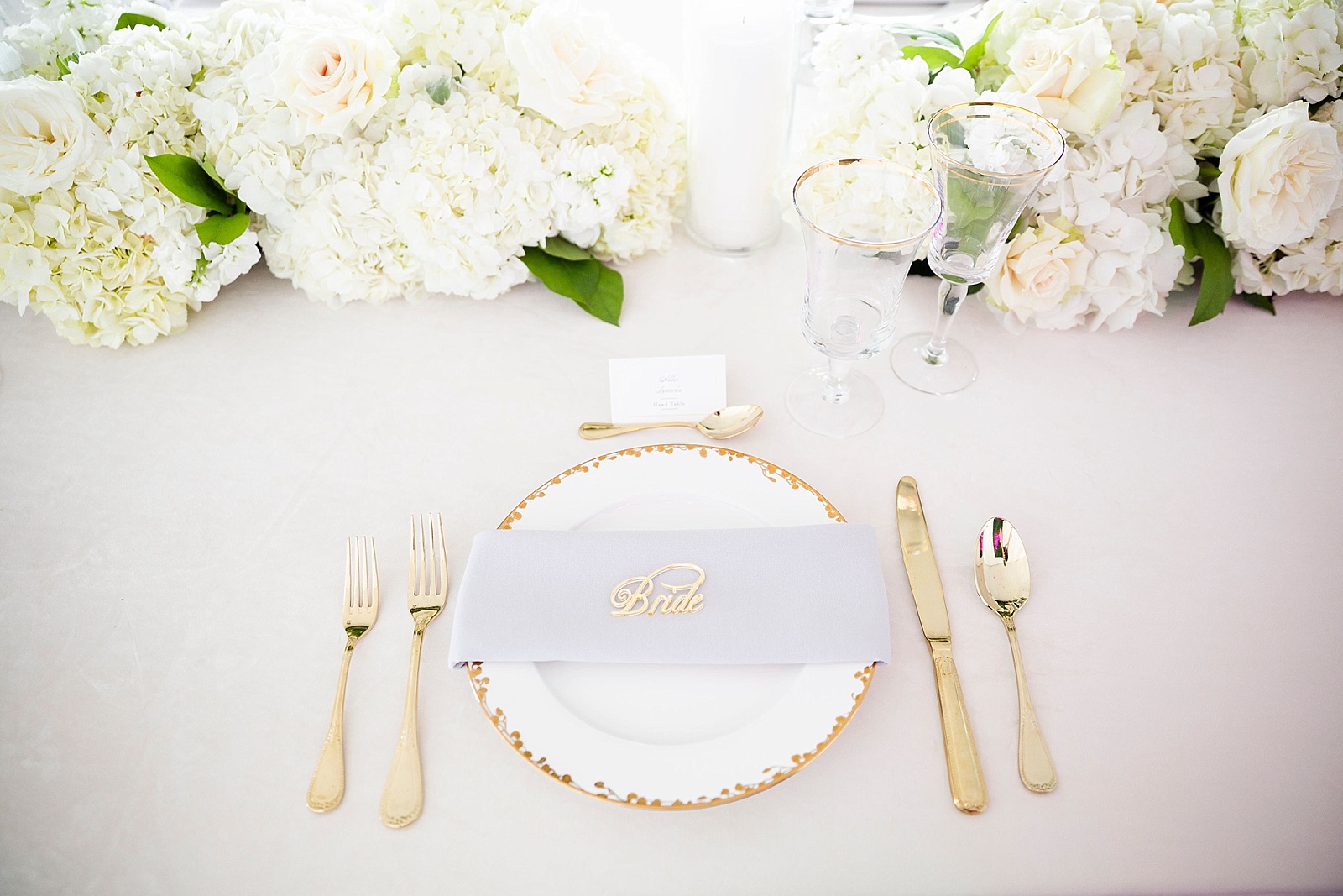 gold and ivory place setting photographed by Randi Michelle Photography