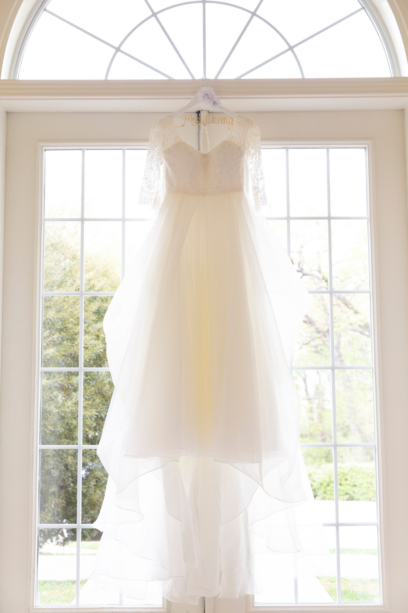 Randi Michelle Weddings photographs bride's gown at Ashton Gardens