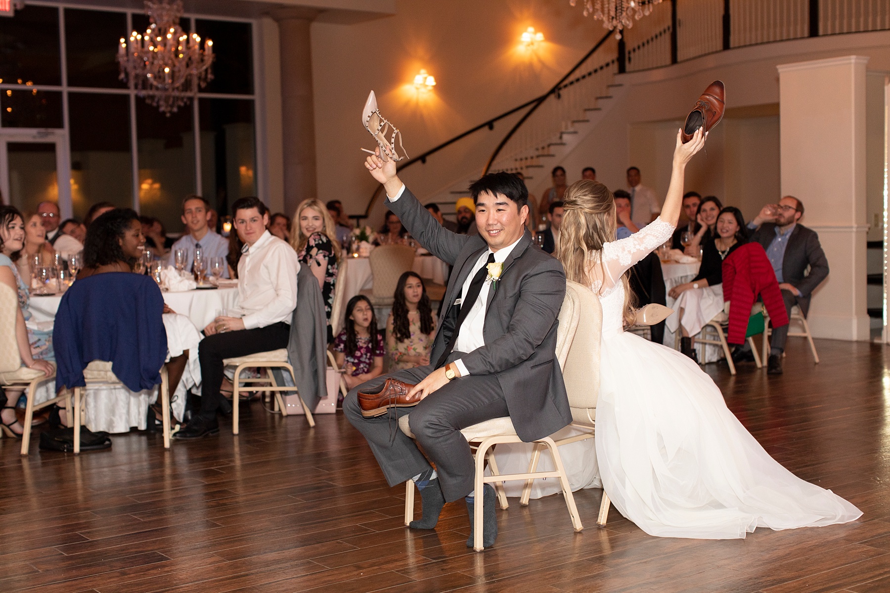 bride and groom play shoe game in Texas photographed by Randi Michelle Weddings