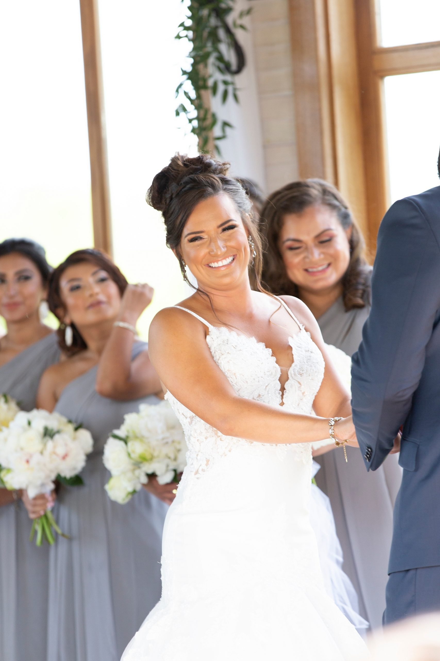 bride laughs during wedding ceremony photographed by Randi Michelle