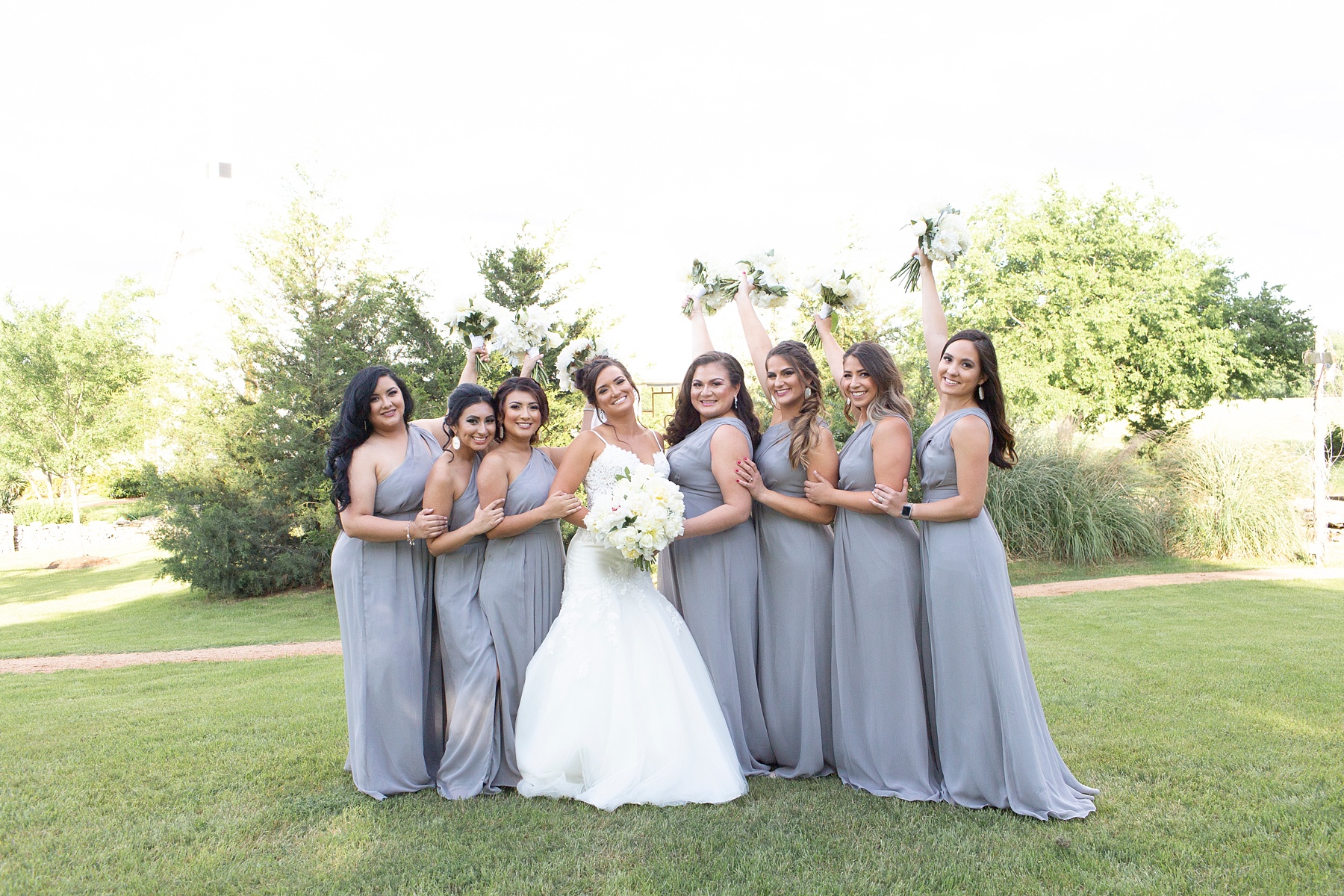 bridesmaids in grey pose photographed by Randi Michelle in Texas