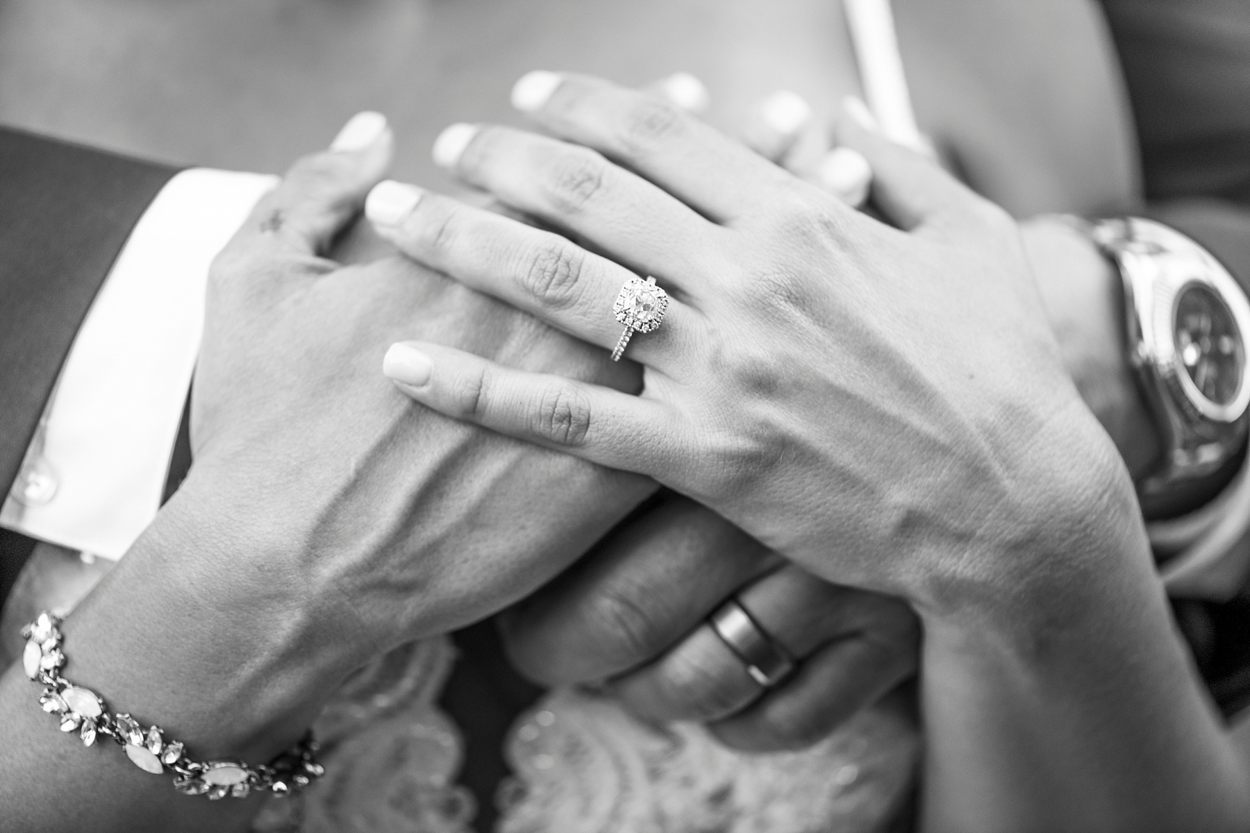 bride and groom's hands with wedding rings photographed by Randi Michelle