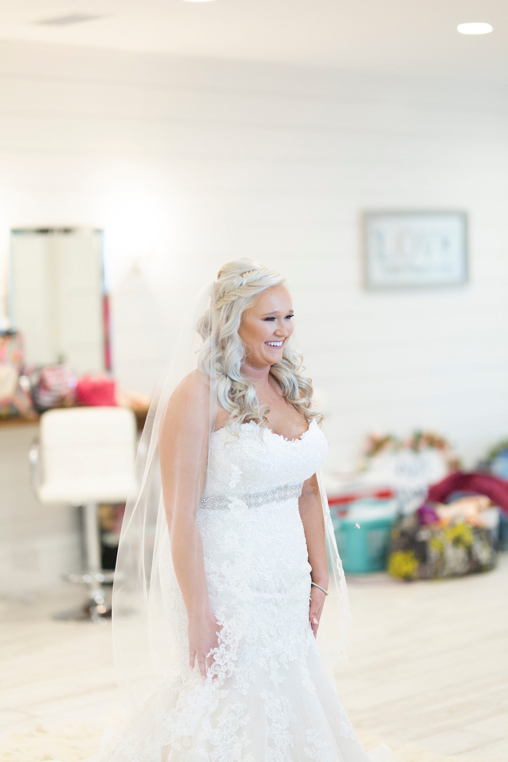 bride faces bridesmaids for first look photographed by Randi Michelle Weddings