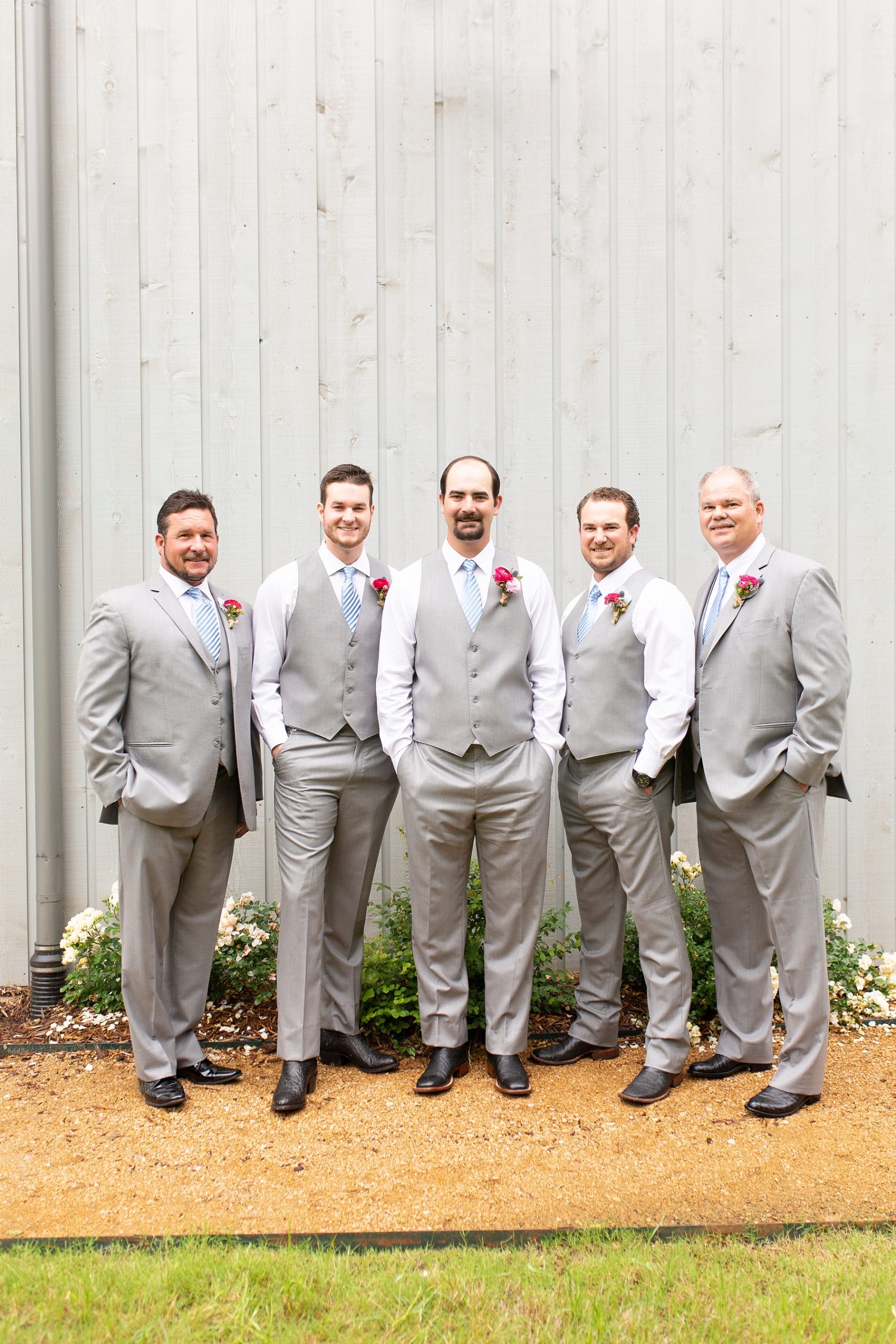 groomsmen pose with groom for Texas wedding photographed by Randi Michelle Weddings