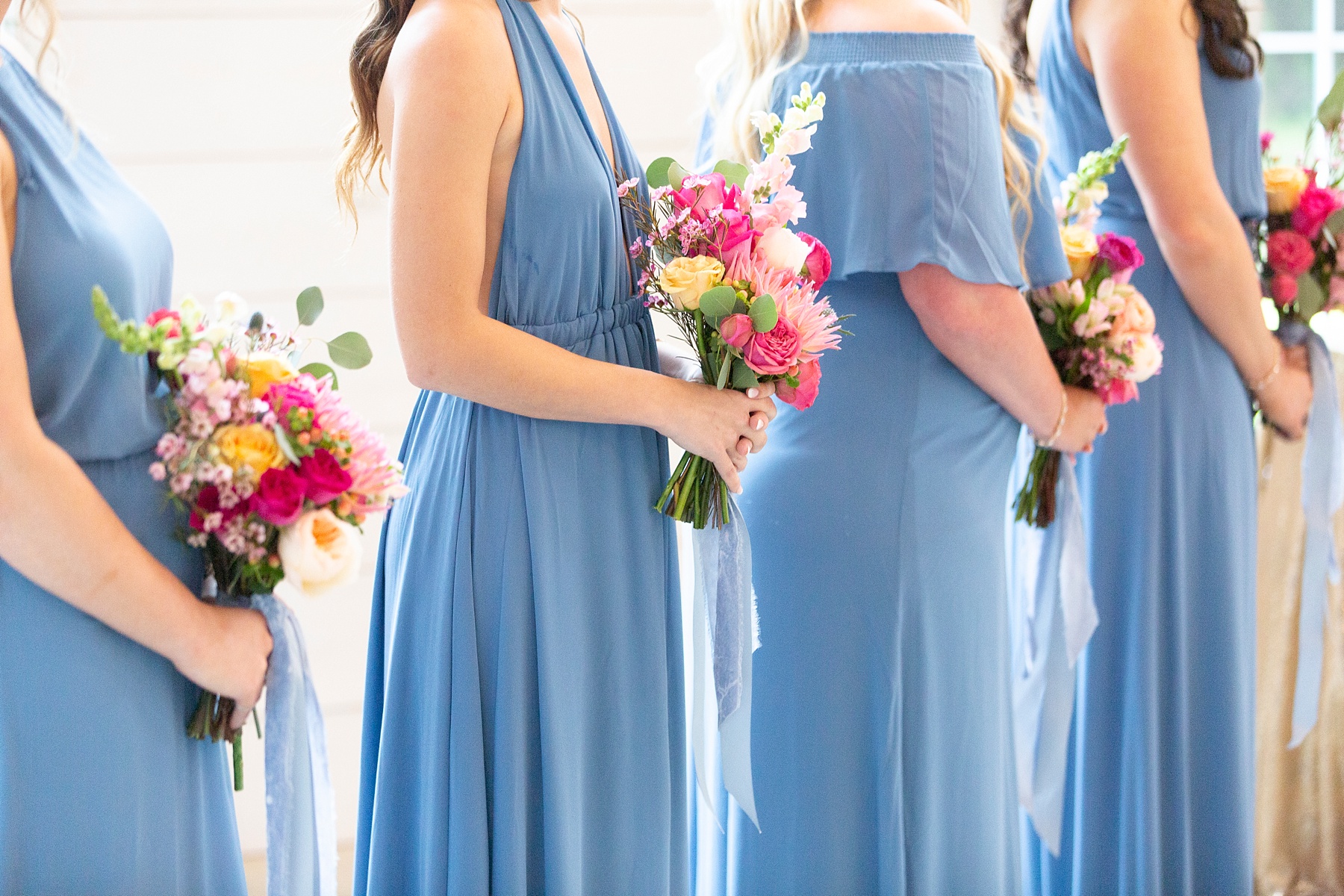 bridesmaids in dusty blue gowns photographed by Randi Michelle Weddings