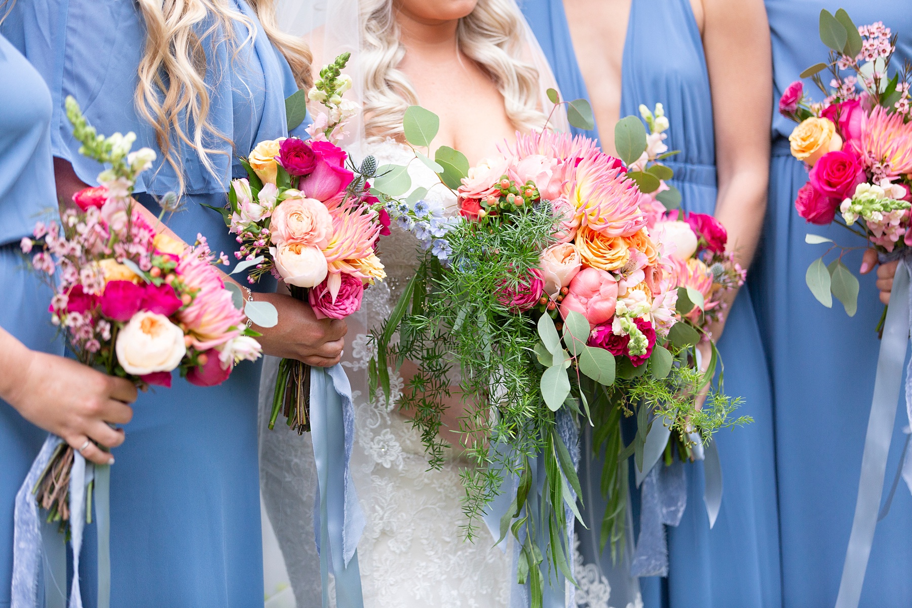 bridesmaids and bride with bright pink bouquets photographed by Randi Michelle Weddings