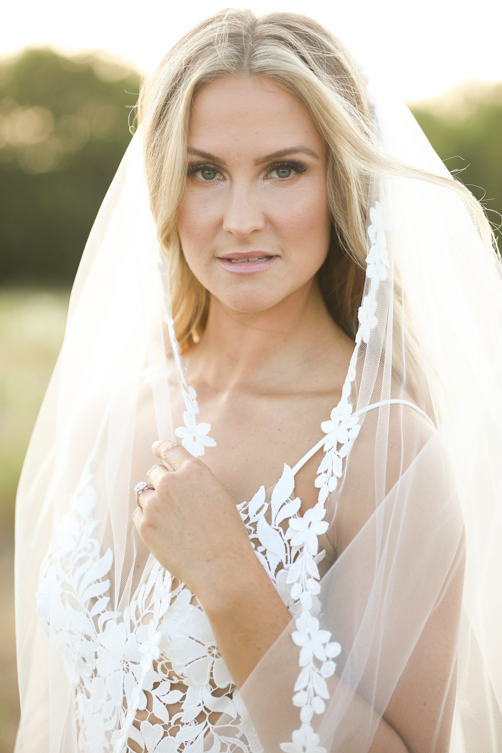 lace wedding veil wrapped around bride photographed by Randi Michelle