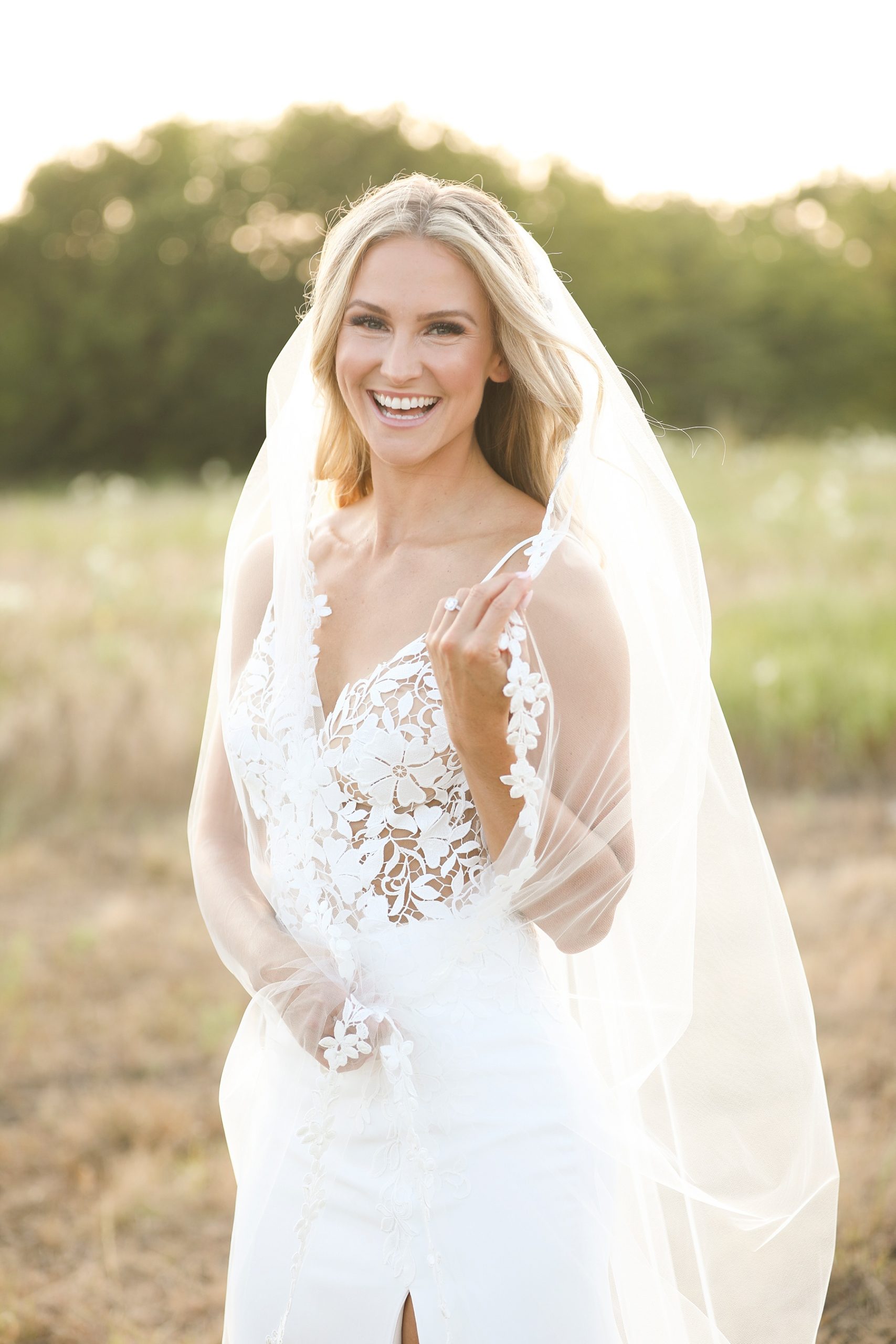 bride laughs during bridal portraits in Texas photographed by Randi Michelle