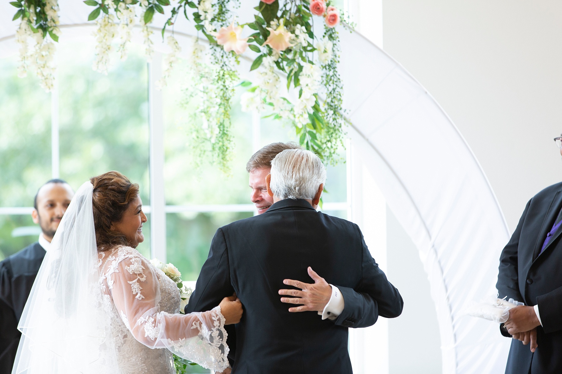 bride's father gives away bride during Texas wedding ceremony photographed by Randi Michelle Weddings