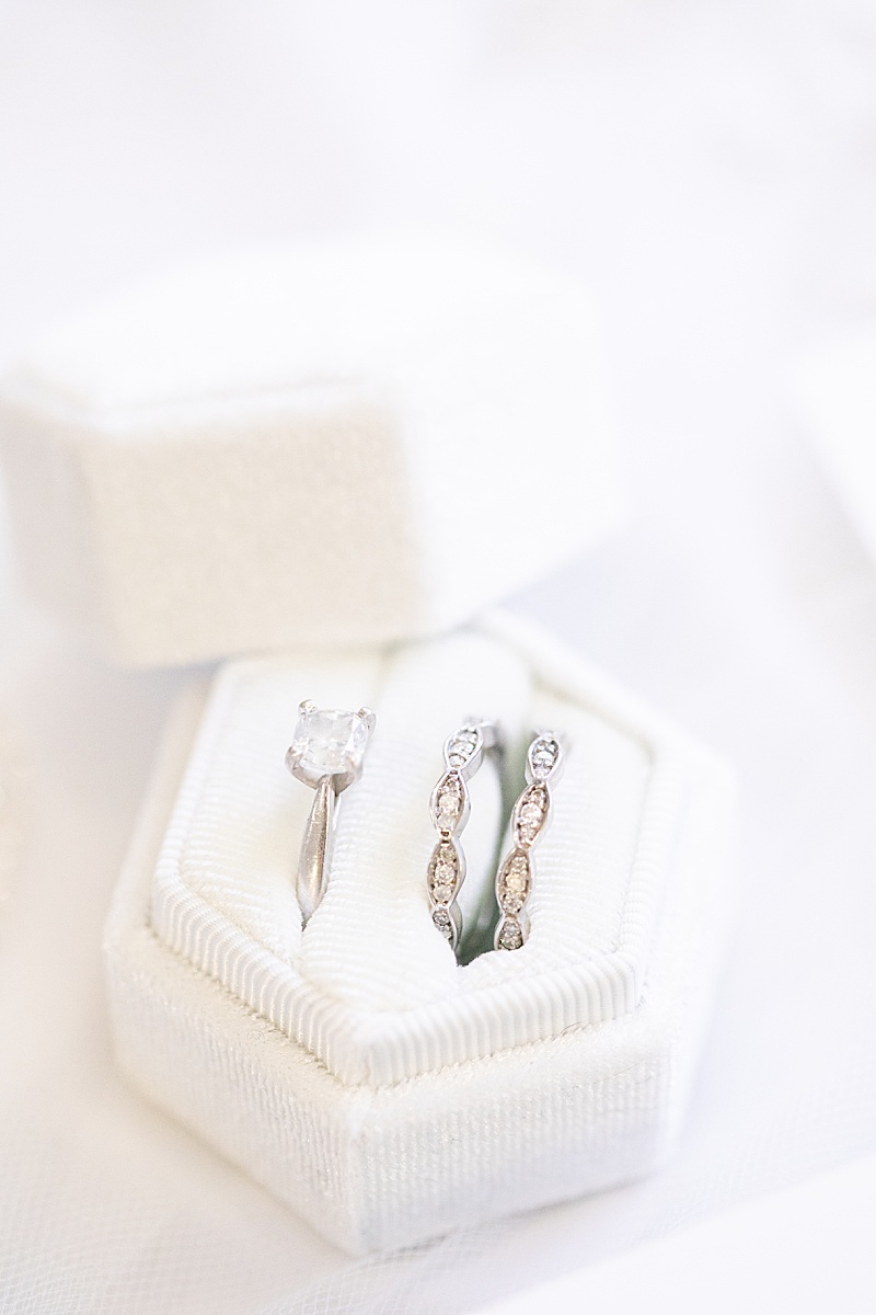 bride's rings in ivory box photographed for TX wedding day