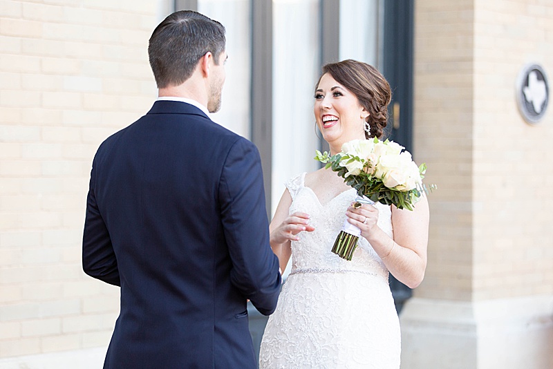 bride and groom react during first look photographed by Randi Michelle