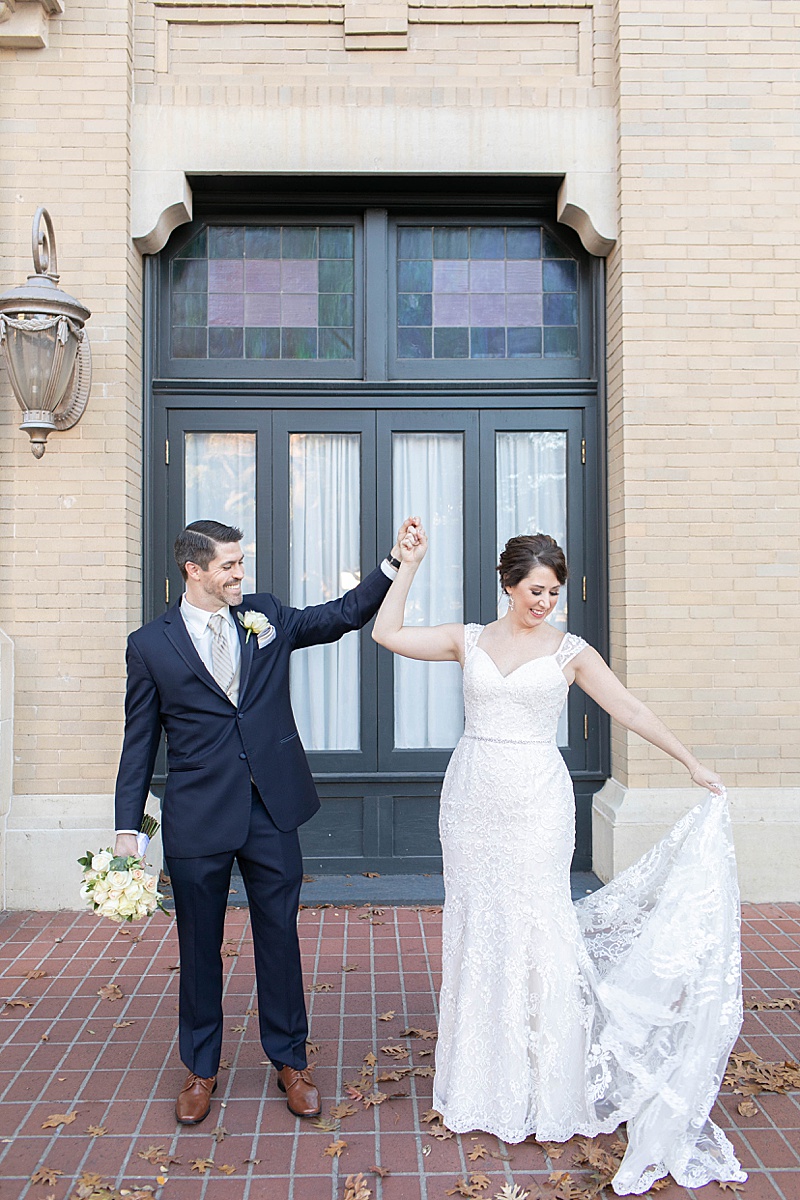 bride and groom dance on street in Texas