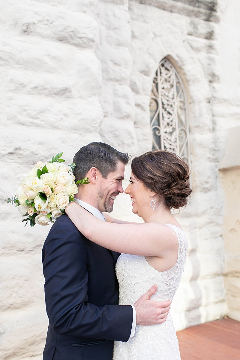 bride and groom laugh during wedding portraits in Texas