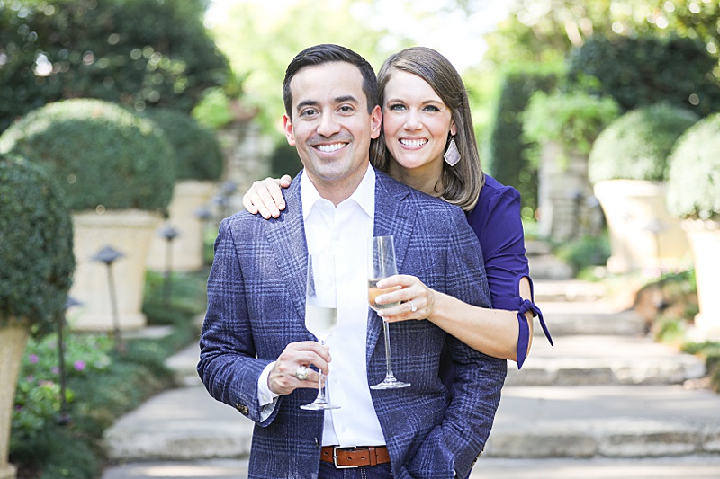 Dallas Arboretum engagement session with champagne glasses for toasting