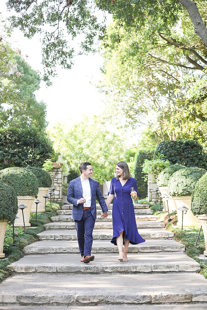 couple walks through gardens at Dallas Arboretum