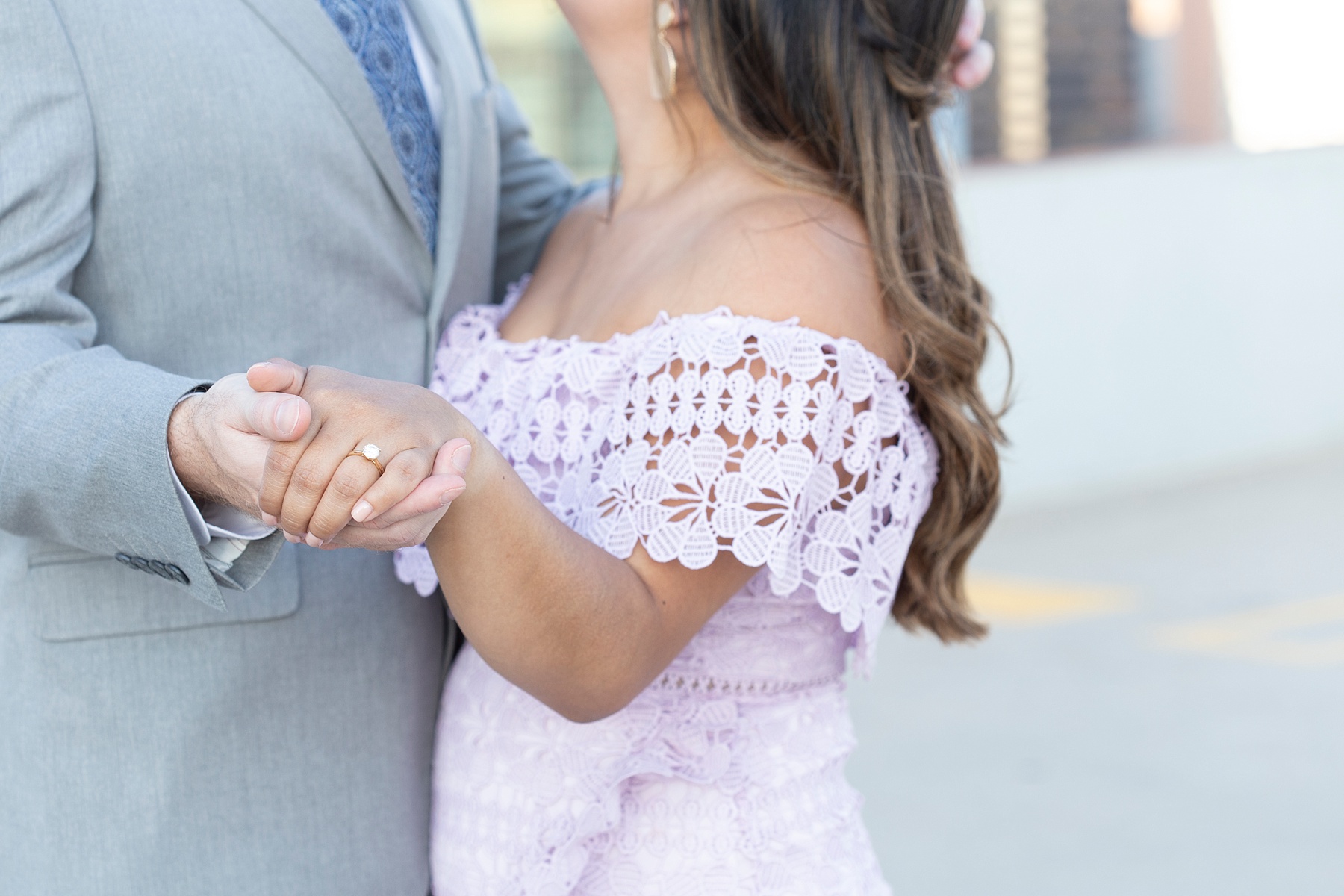 bride in lilac gown shows off wedding ring to Randi Michelle Weddings