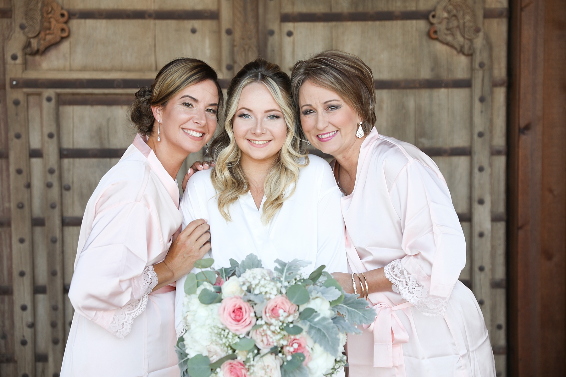 bride with mother and grandmother pose for Randi Michelle Weddings
