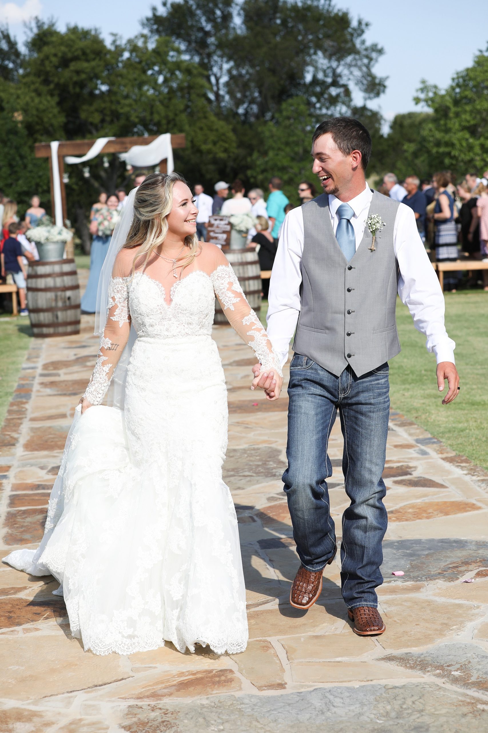 Randi Michelle Weddings captures bride and groom walking up aisle