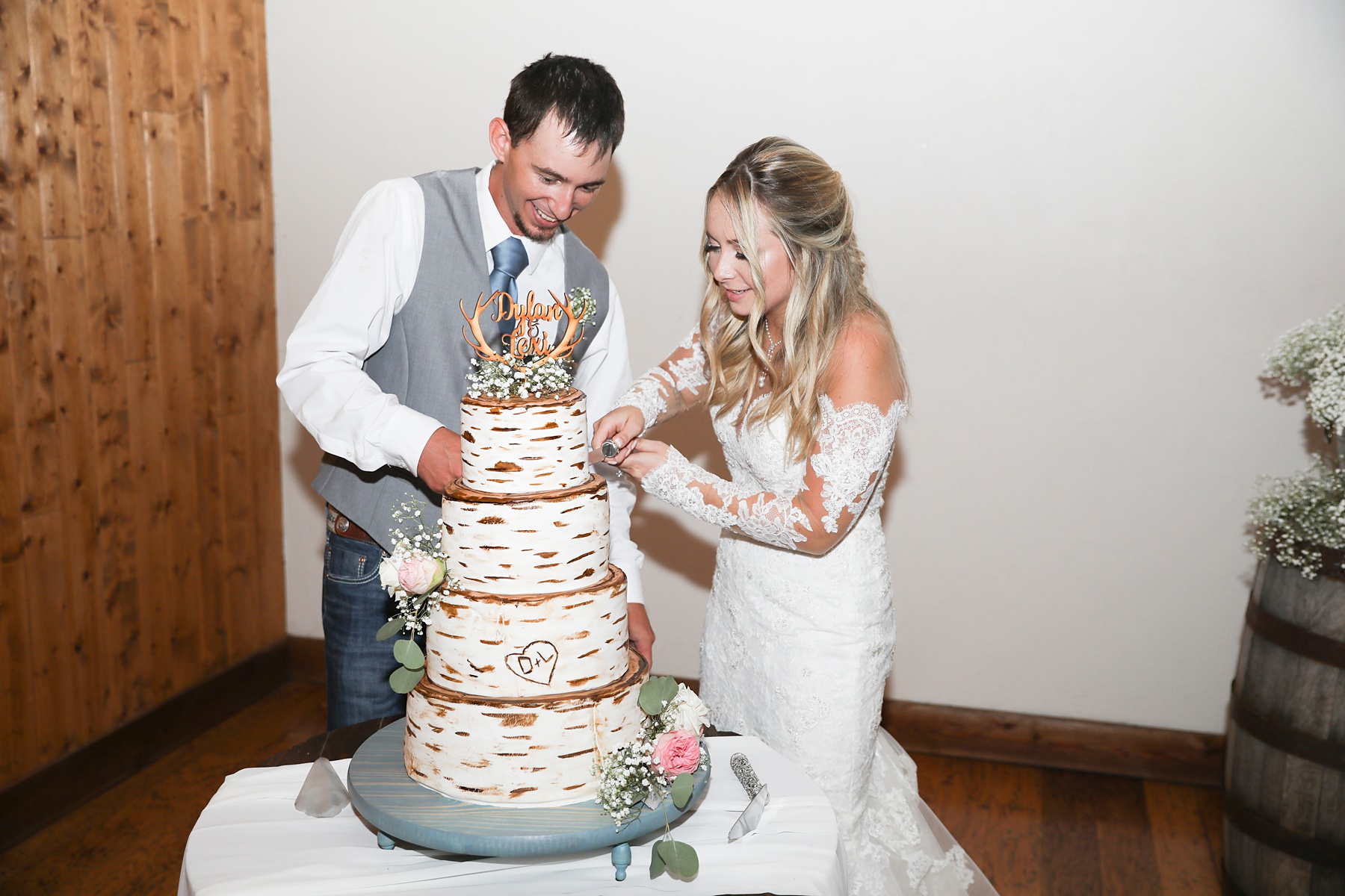 bride and groom cut rustic wedding cake at Lucky Spur Ranch