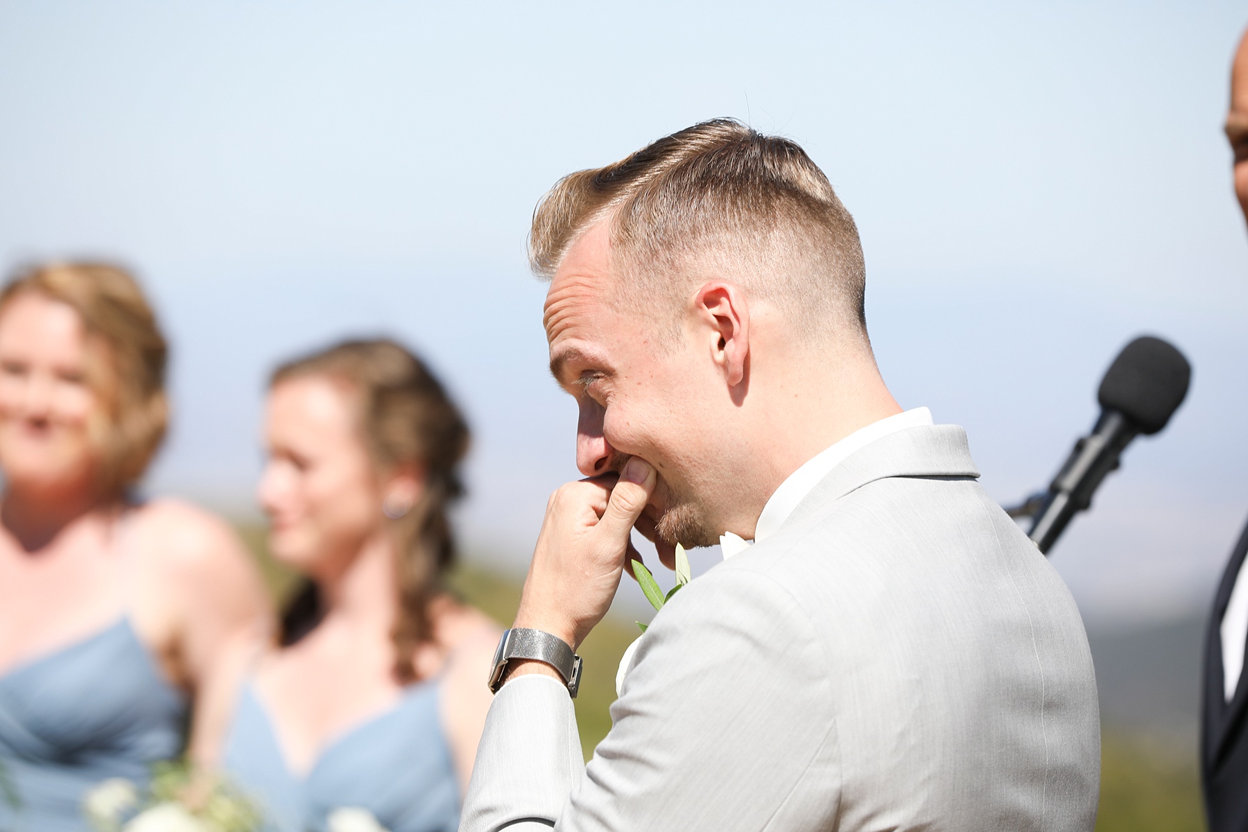 groom cries watching bride walk down the aisle at Providence Plateau