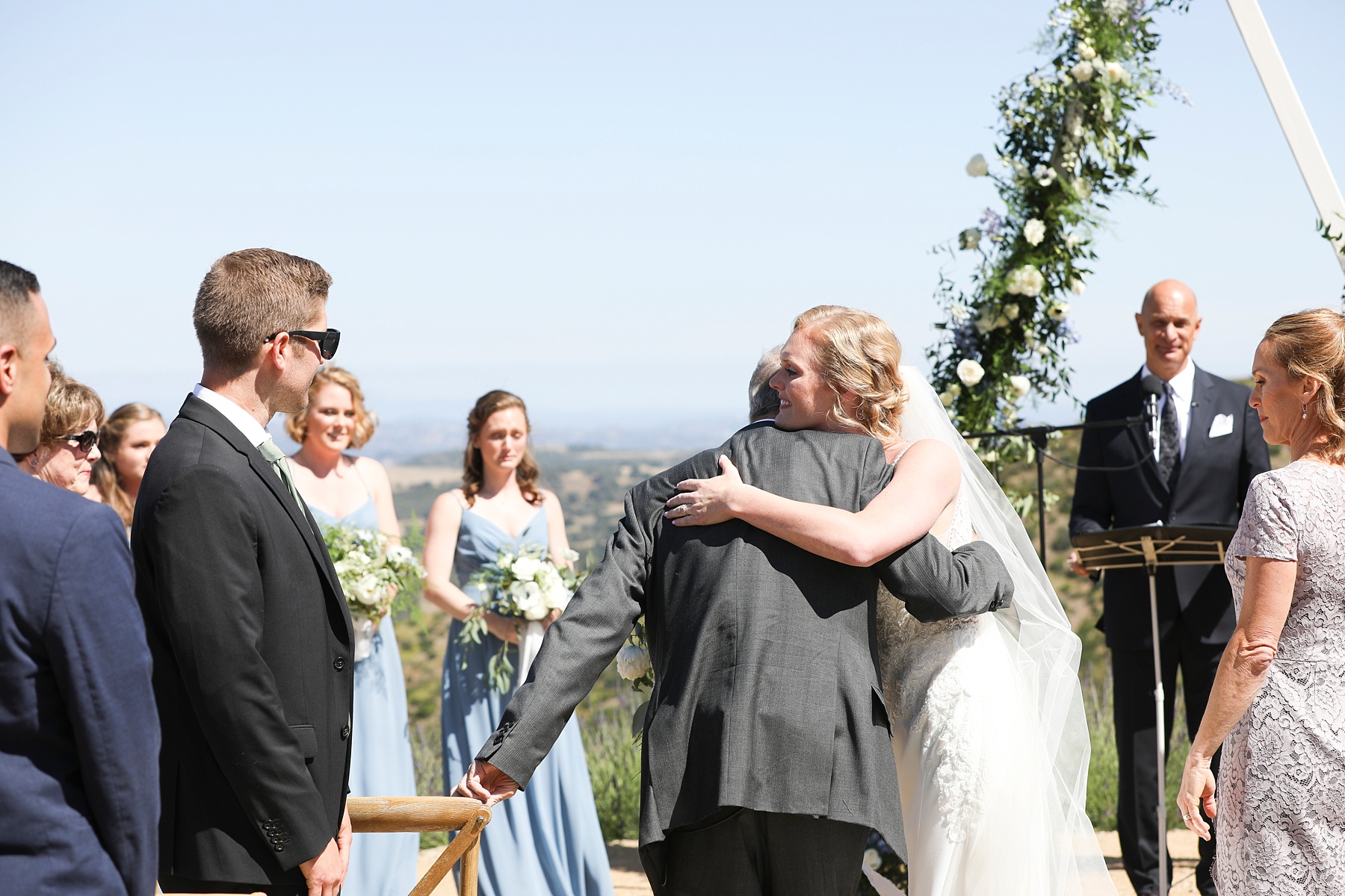 bride hugs father before wedding ceremony photographed by Randi Michelle Weddings