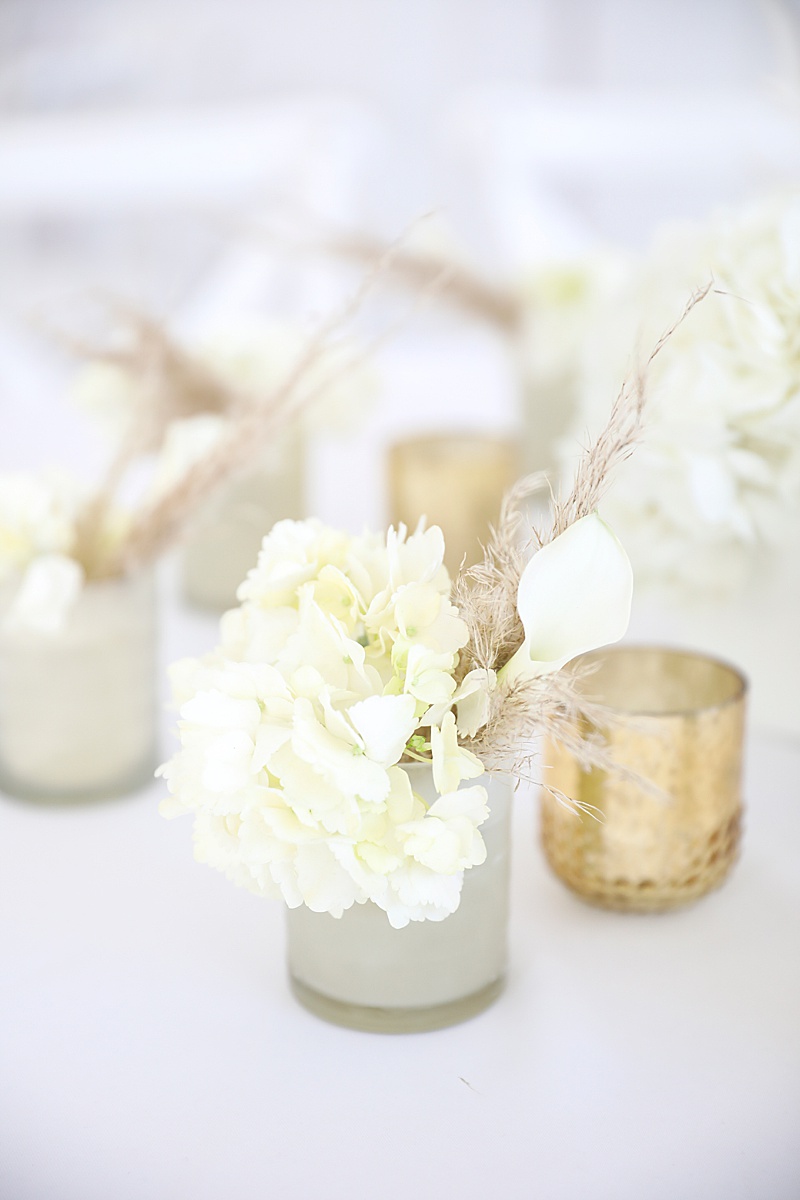 gold and white centerpieces for gala
