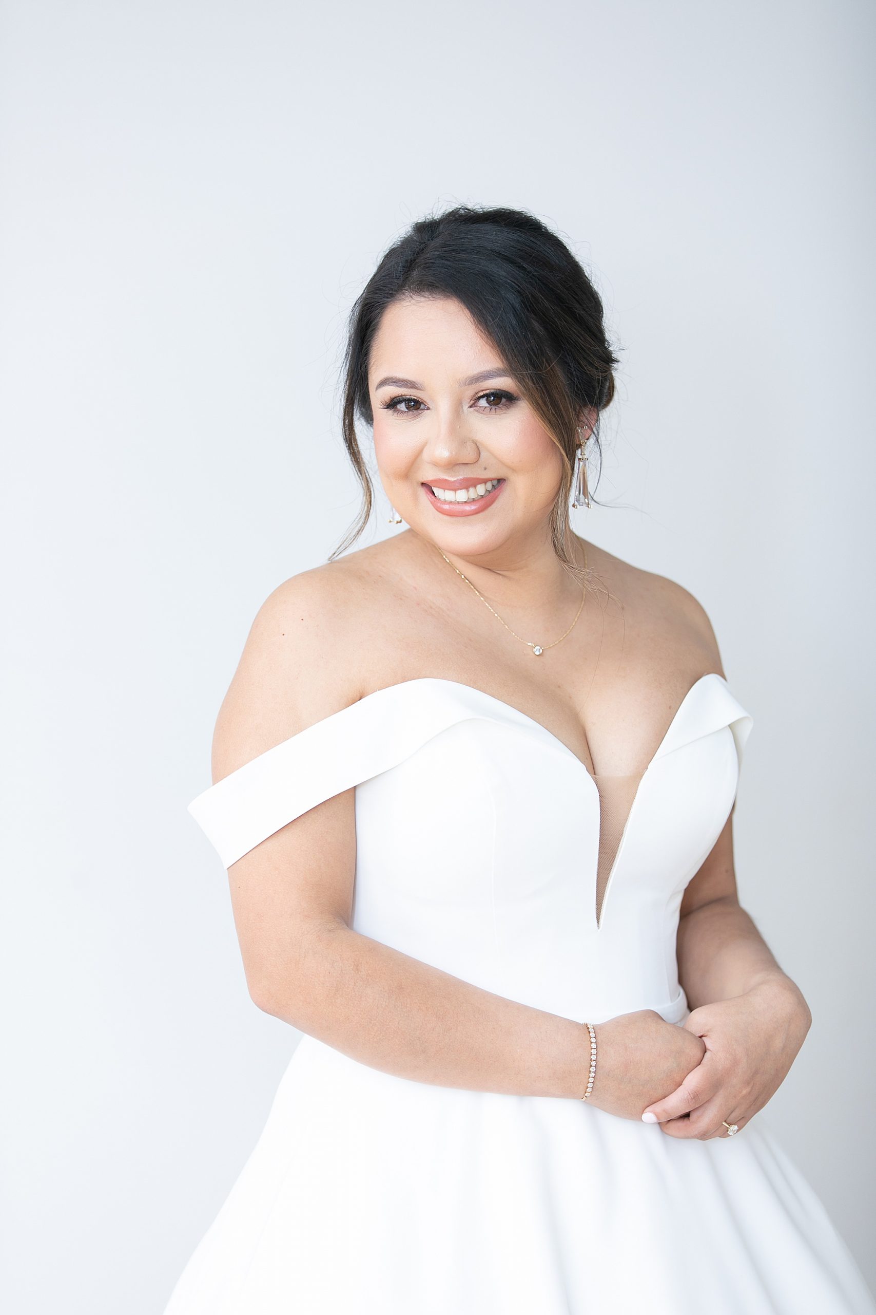 bride smiles in wedding gown at DFW photographer