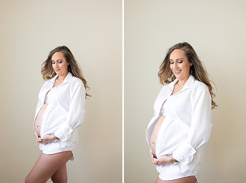 mom in button up shirt poses for Dallas maternity session