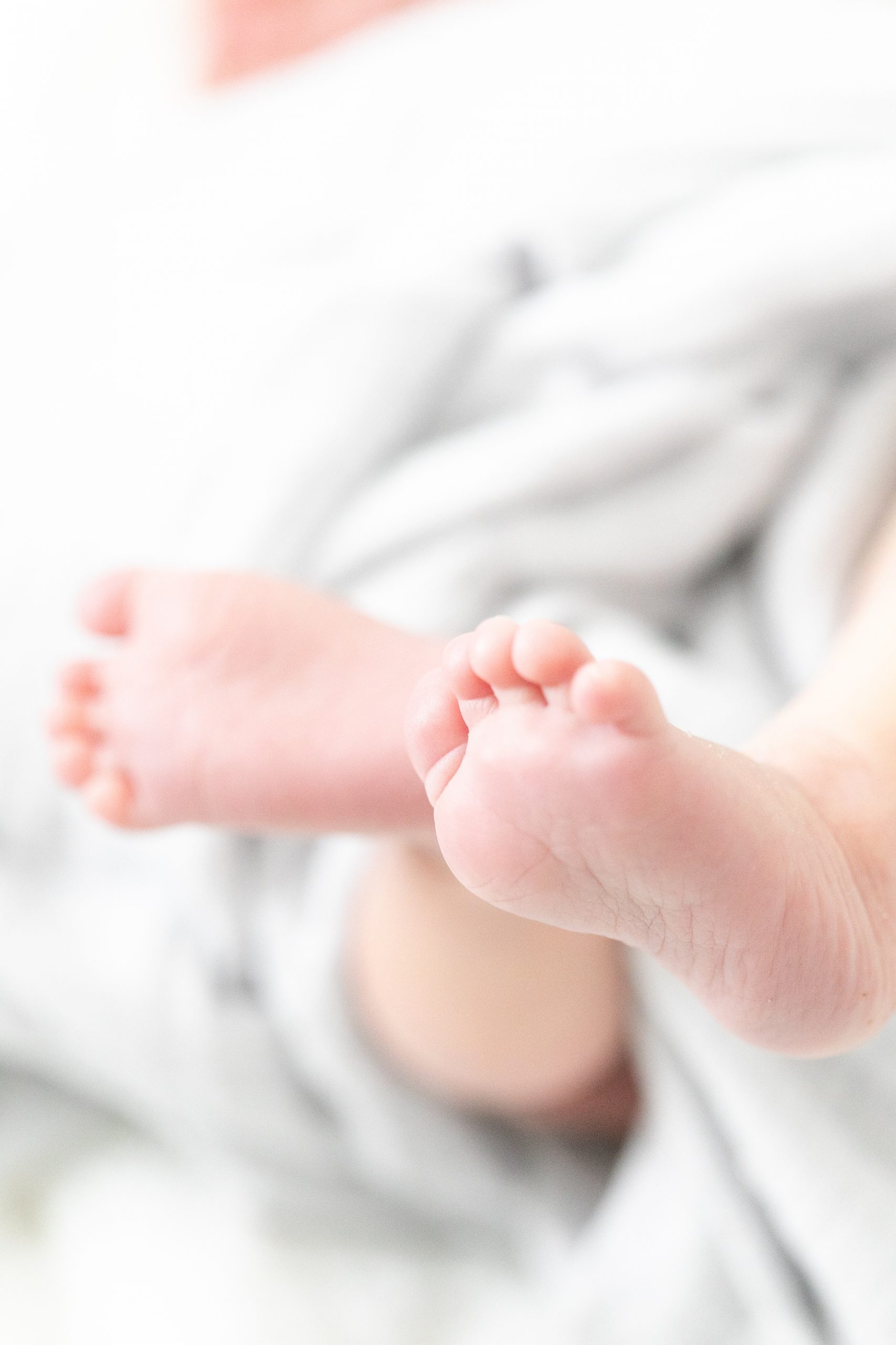 lifestyle newborn session portraits of baby's feet