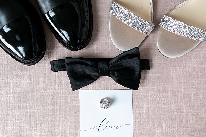 bride and groom's shoes with ring