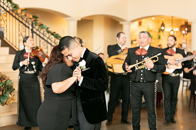 mom and groom dance at Chapel at Ana Villa wedding reception