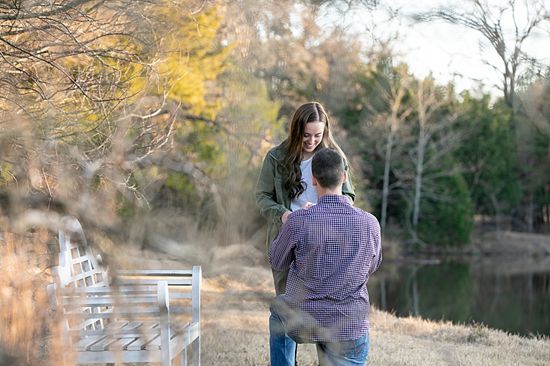 proposal by lake in the fall photographed by Randi Michelle Weddings