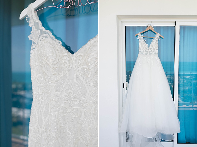 wedding dress hangs on sliding door at hotel