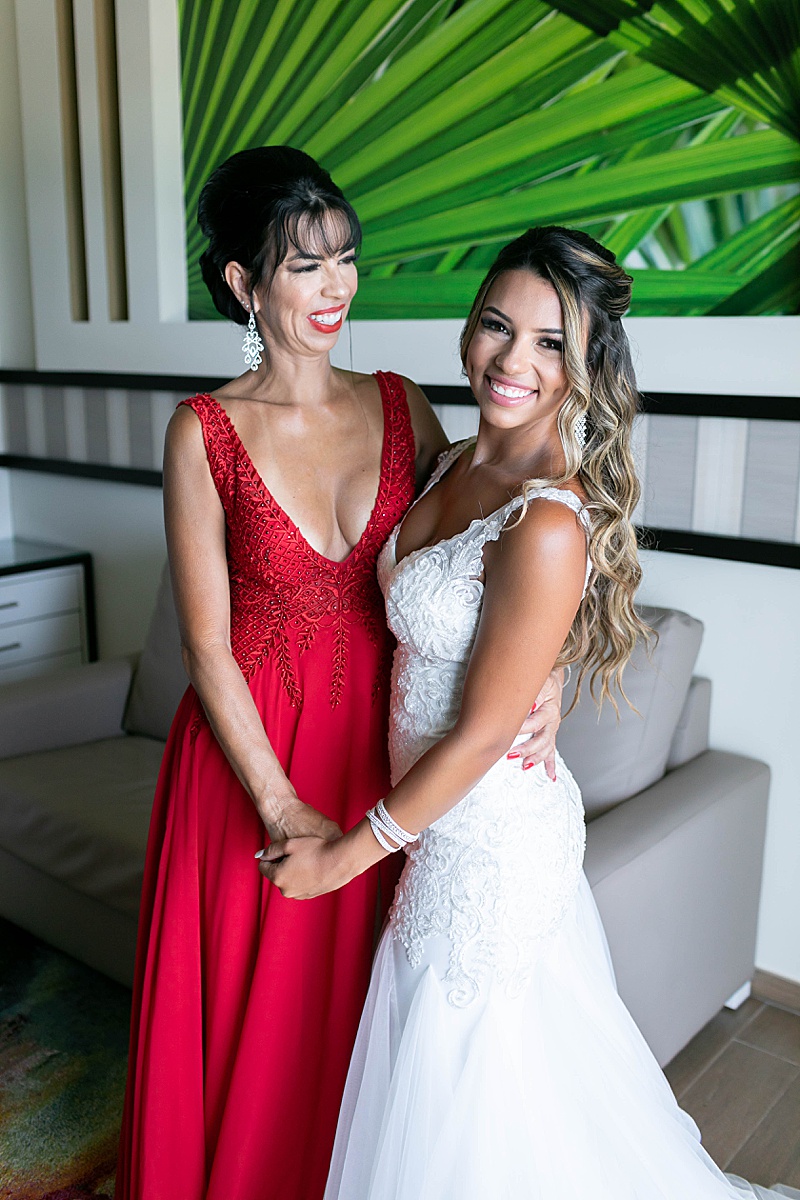 mom and daughter pose before wedding day