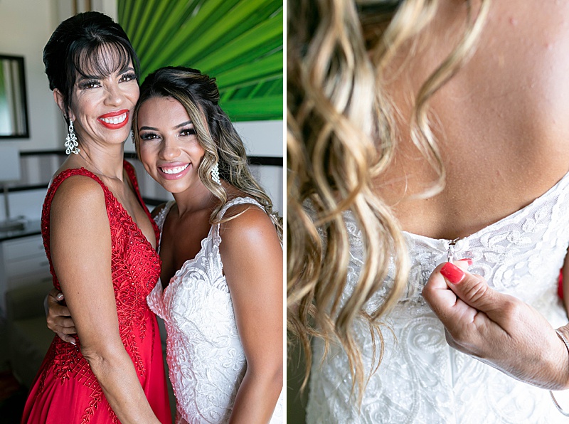 bride gets help from mom for wedding dress