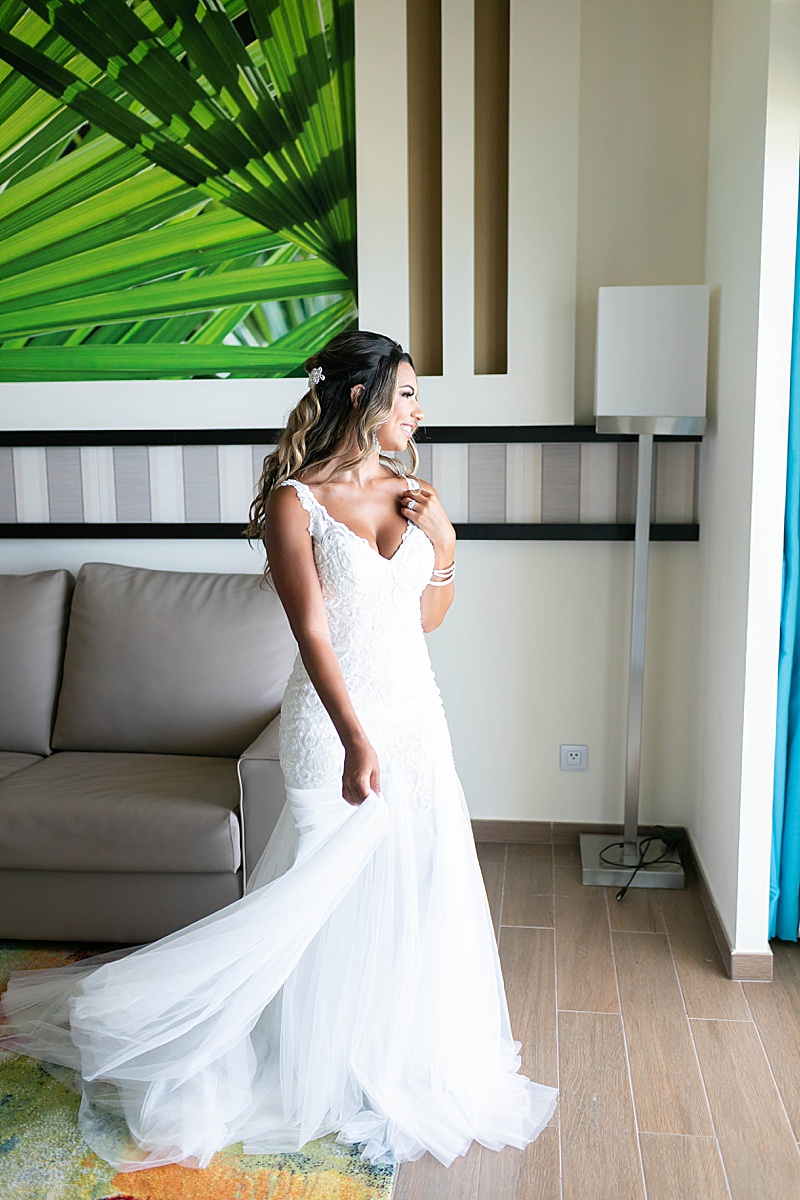 bride twirls with wedding dress in Cancun