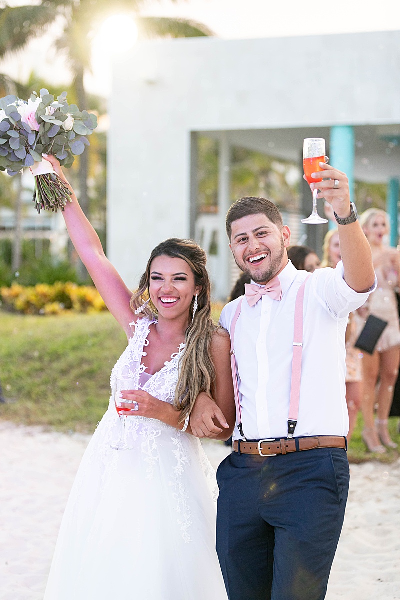 newlyweds enter reception with signature cocktail