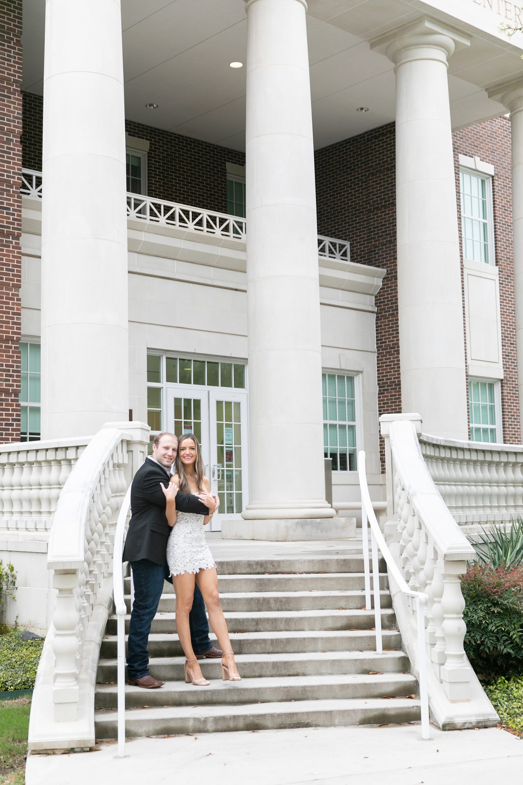 couple poses on staircase at SMU Dallas
