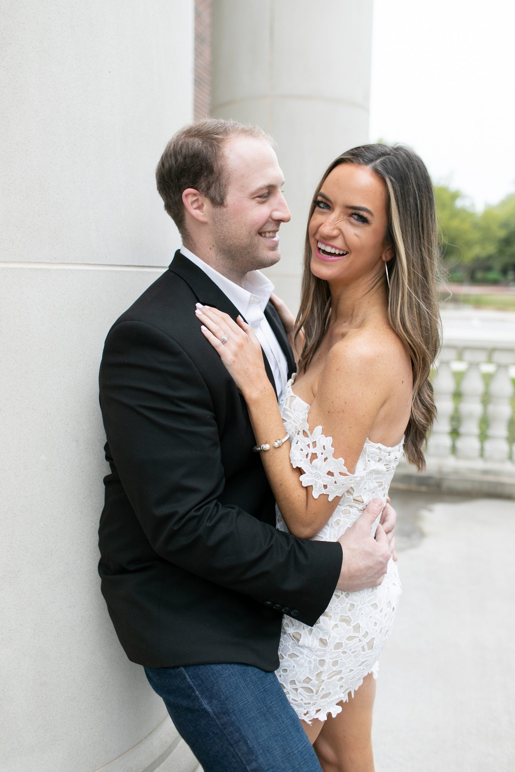 groom makes bride laugh during engagement session in Dallas TX