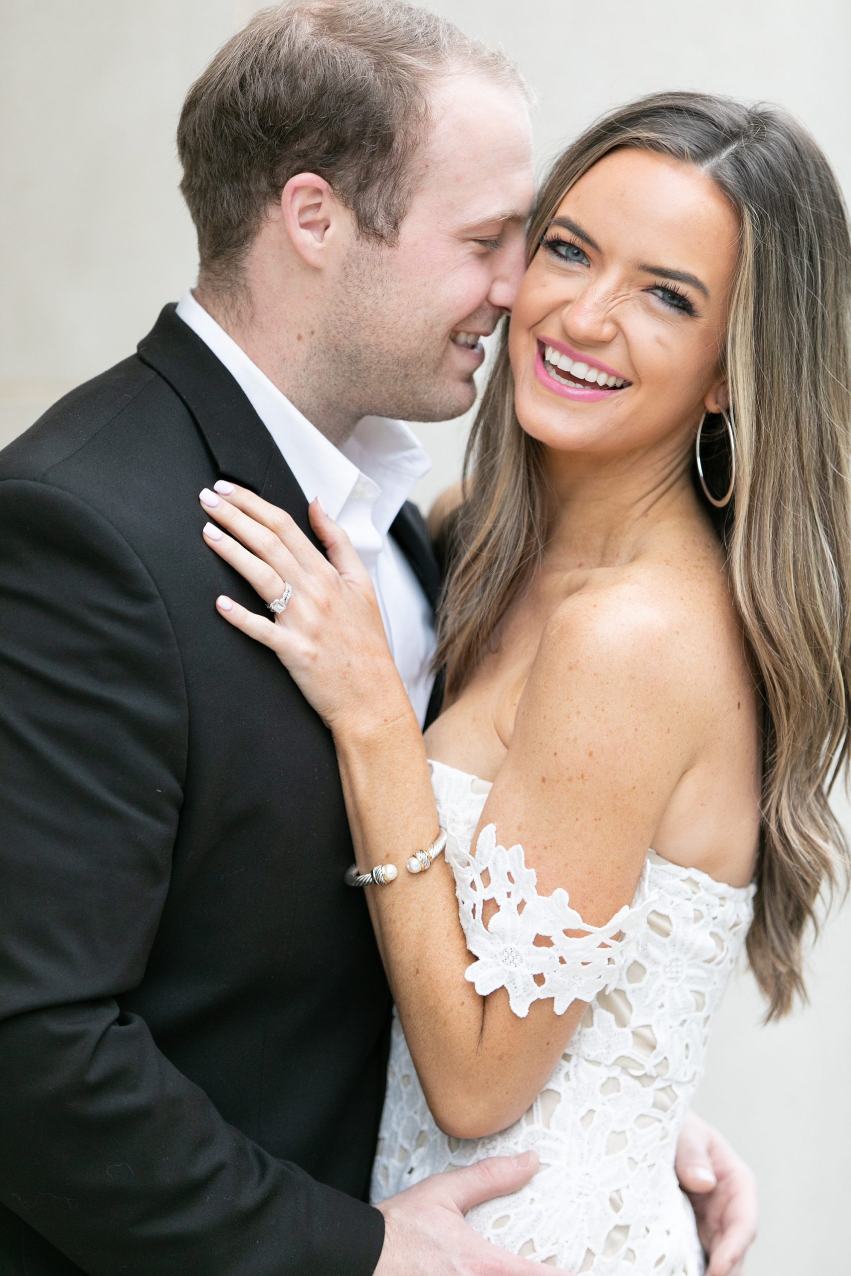 bride laughs during engagement session with Randi Michelle