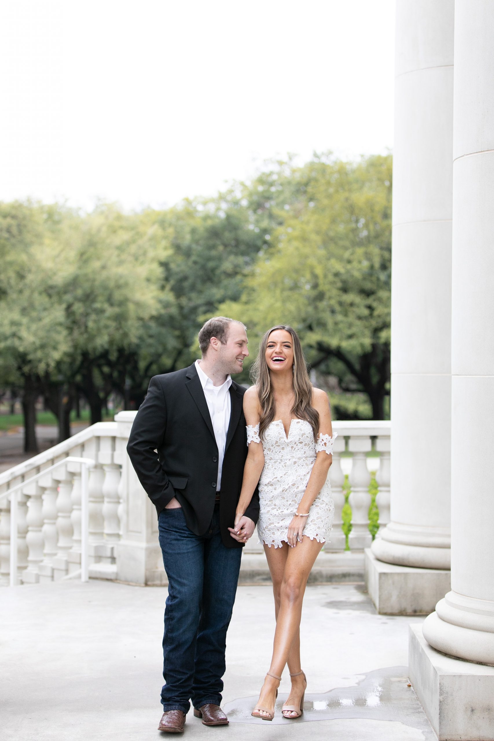 bride laughs during engagement session in Dallas TX