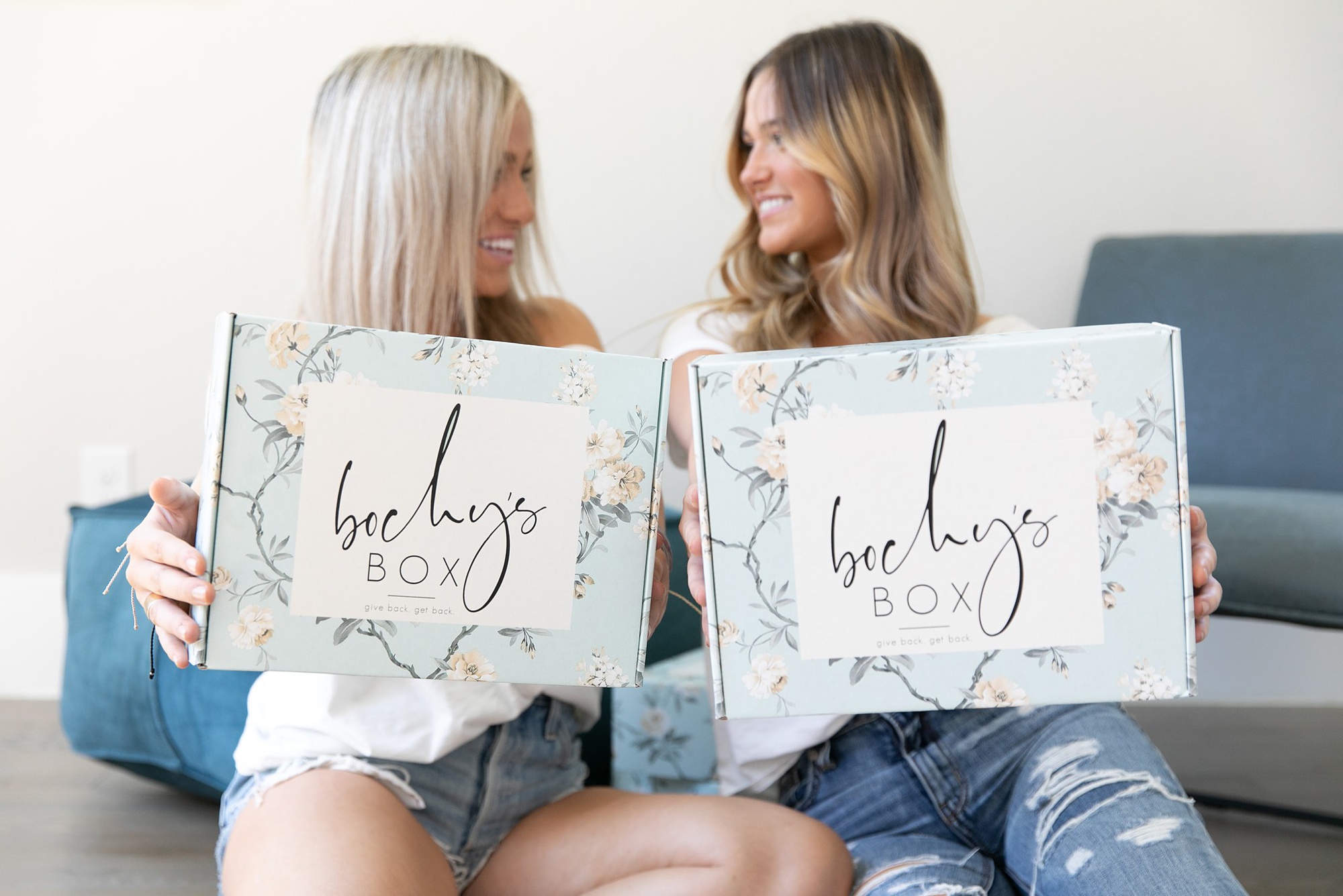women hold Bochy's subscription box during styled shoot