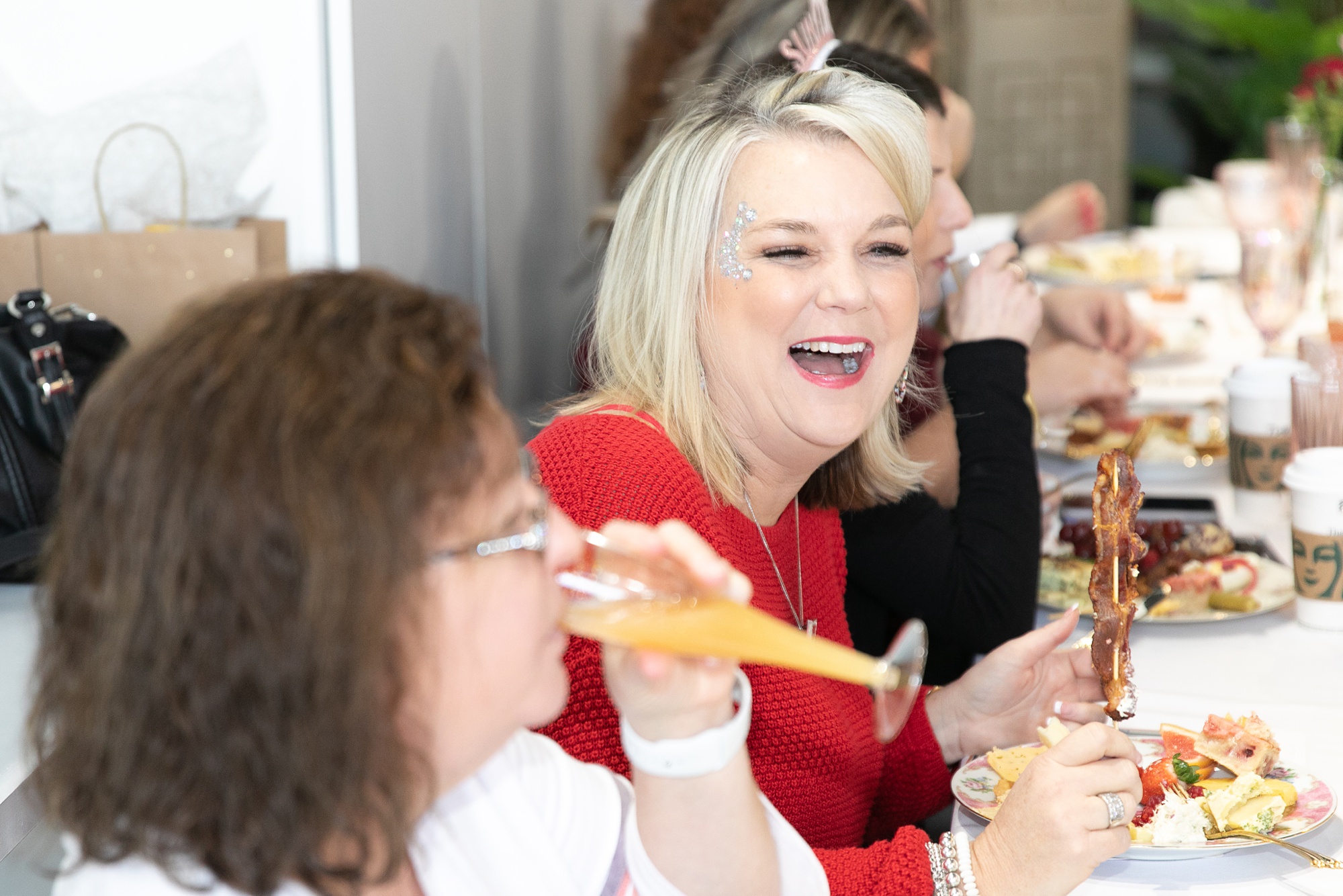 guests laugh during brunch at Dallas Girl Gang event