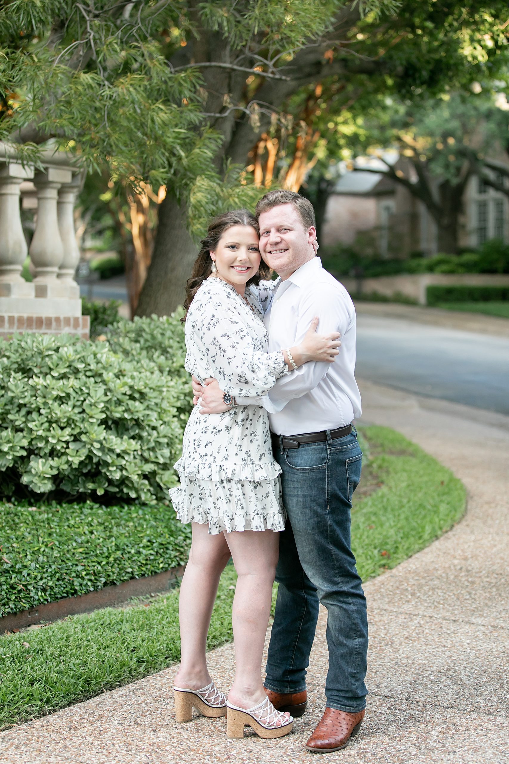 Texas engagement session with couple on sidewalk in neighborhood