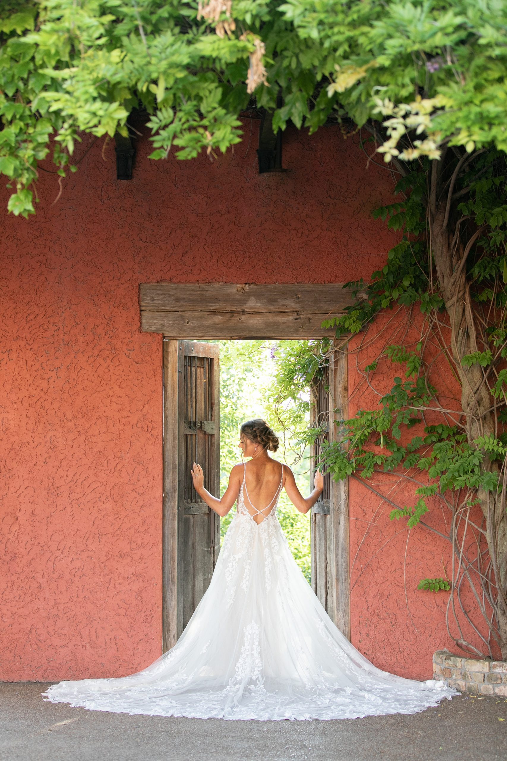 bride stands in doorway at Stoney Ridge Villa