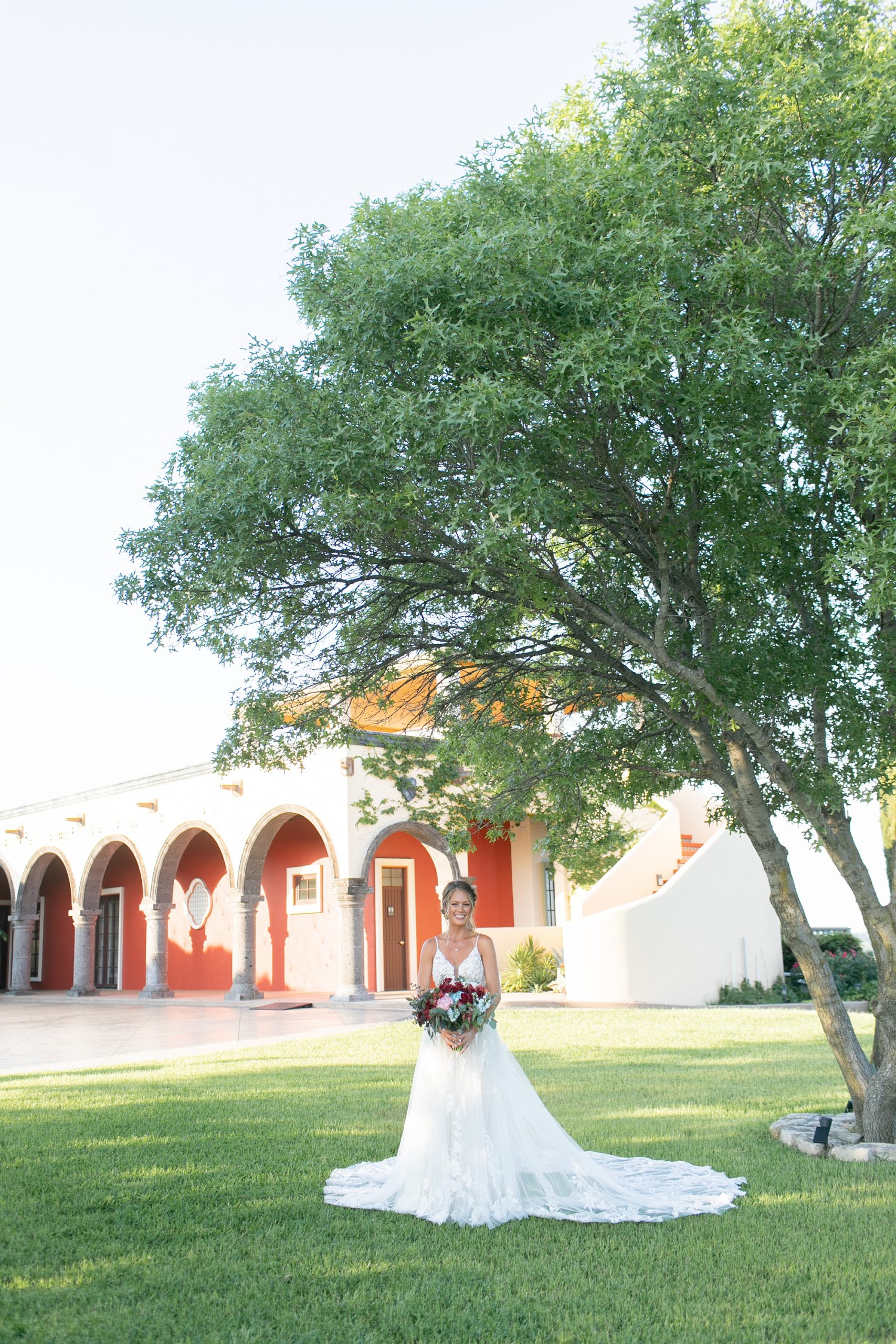 Texas bridal portraits by big tree at Stoney Ridge Villa