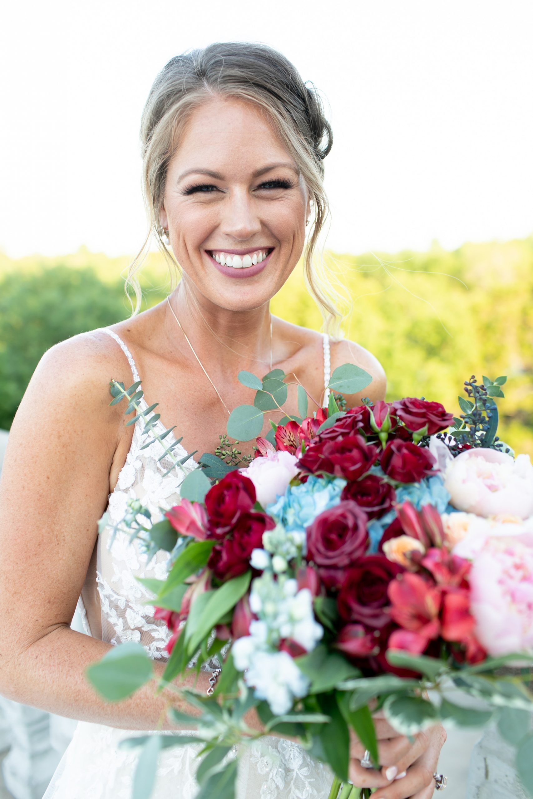 bride holds bouquet and laughs in Texas